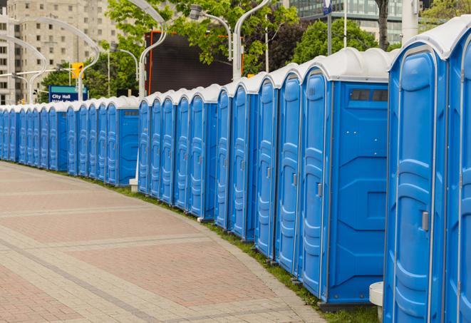 a row of portable restrooms at an outdoor special event, ready for use in Antelope